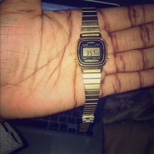 casio gold and black digital watch