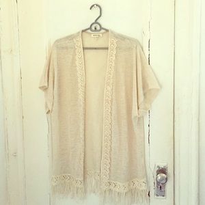 Cream poncho.