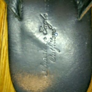 Black leather flip flops