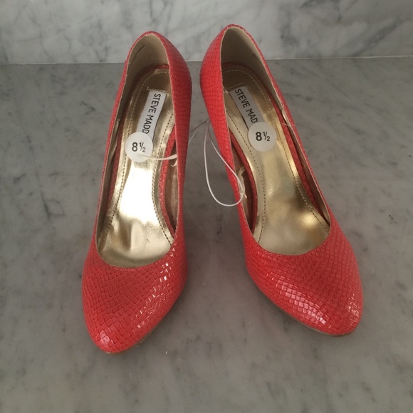 Coral snakeskin pumps