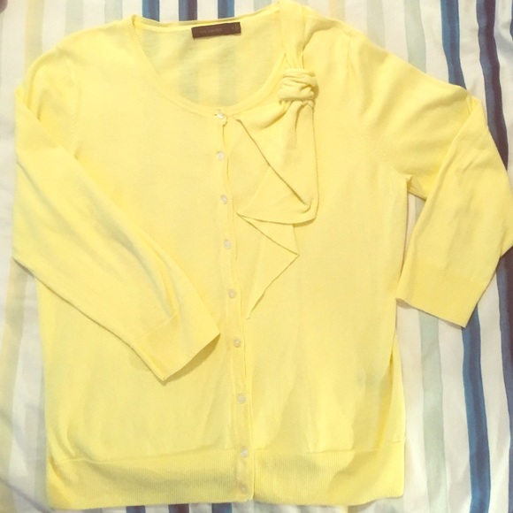 Yellow cardigan.