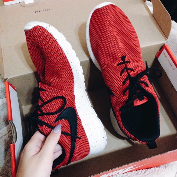 Red & black Nike Roshe Runs.