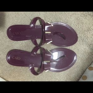 Deep purple jelly flip flops. 12