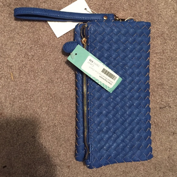 Urban expressions woven fold over clutch.