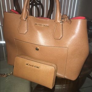 Michael Kors purse with matching wallet .