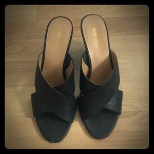 Black cross sandal wedges by Nine West. 7 1/2