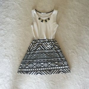 Cute dress with necklace attached.