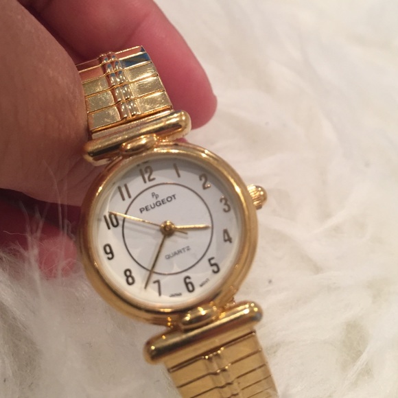 New peugeot gold watch