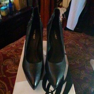 Black high heel pump worn only once.