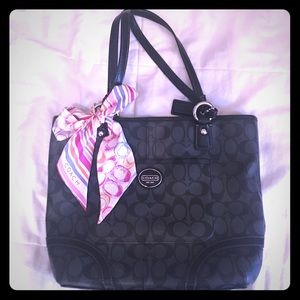 Black Coach bag with a Coach silk scarf