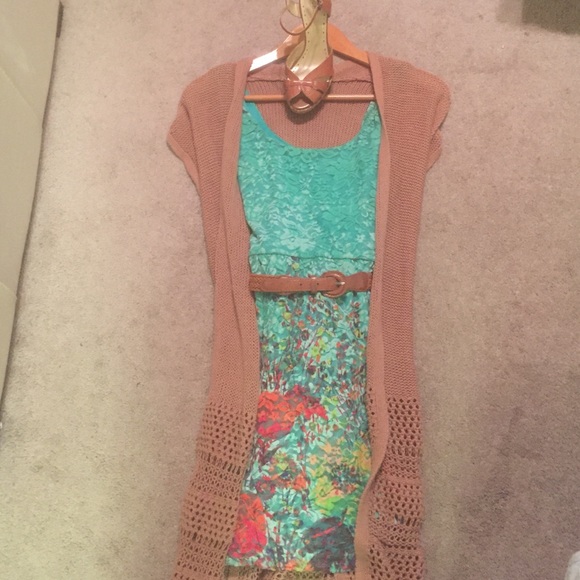 Above the knee green lace-flowered dress.