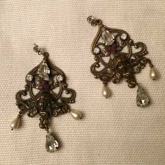 Gold coloured earrings with faux jewels.