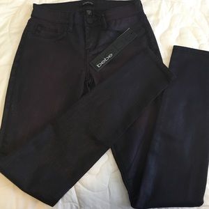 NWT- Bebe Purple/black skinny jeans