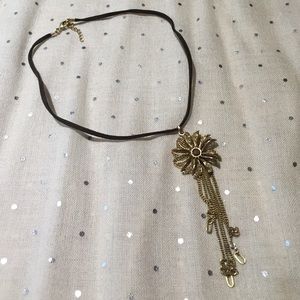 Brown necklace with 3-d gold flower