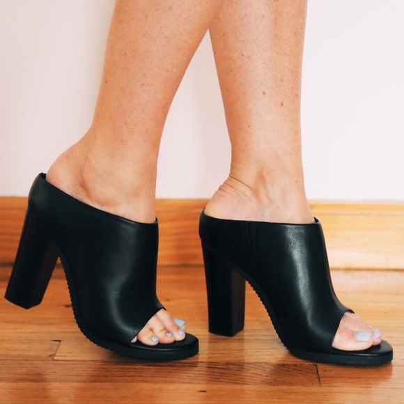 Tibi black heeled mules