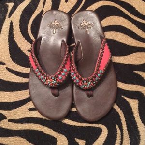 Crossed flip flops by Gypsy Soule