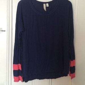 Knit navy tee with coral striped sleeves
