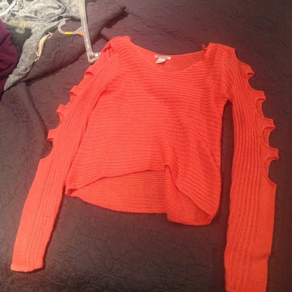 Orange sweater with slitted sleeves