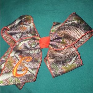 camo hair bow with "C" on it.