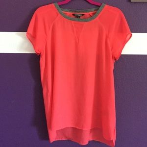 A bright pink sheer top