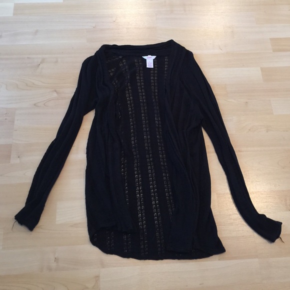 Black cardigan with small cutouts going through it