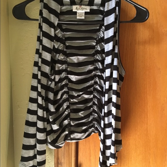 Over sleeveless sweater