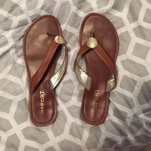 Leather flip flops with gold embellishment