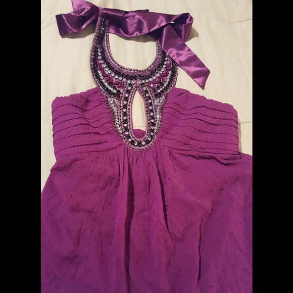 Gorgeous purple top decorated with rhinestones