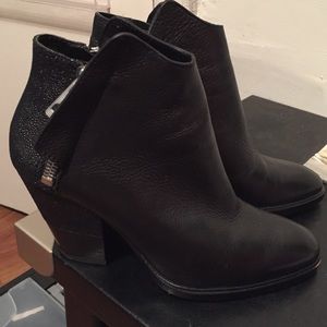 Black leather ankle booties in mint condition.
