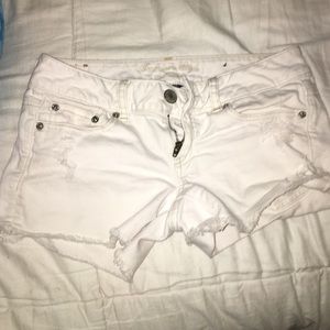 American Eagle white shorts with rips