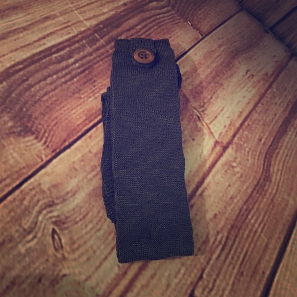 Boot socks with pecan colored button on sides.