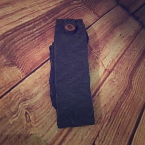 Boot socks with pecan colored button on sides.