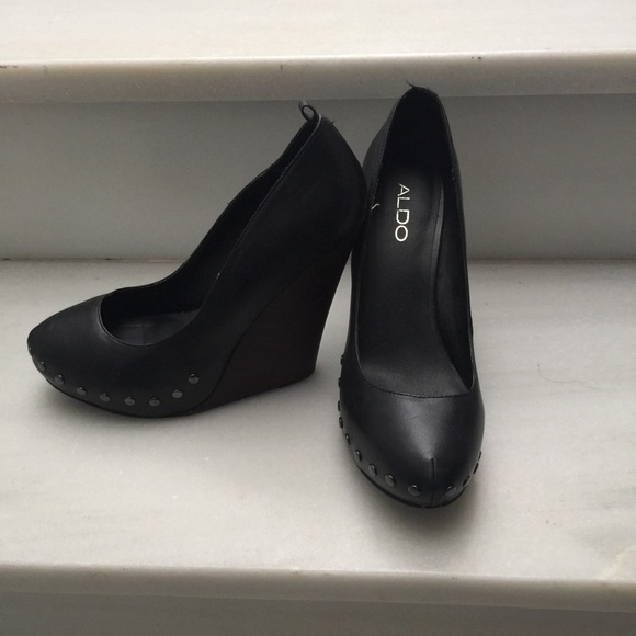 Black leather wedges with studded hardware