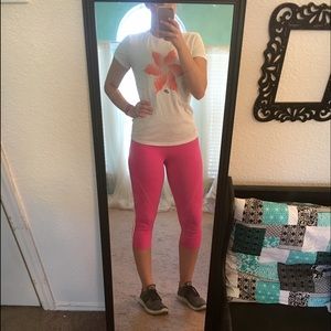 Bright pink lulu lemon workout leggings.