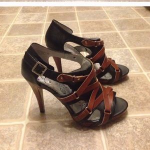 Tan and black strapped heals