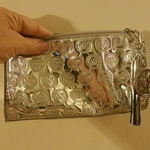 Micheal Kors Metalic makeup bag or hand held