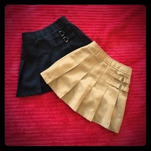Girls navy blue and tan uniform skirts.