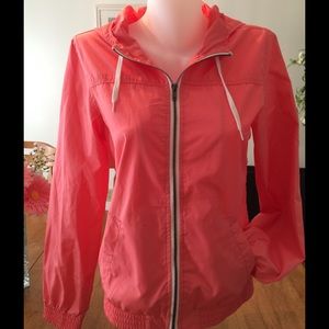 Orange wind breaker.