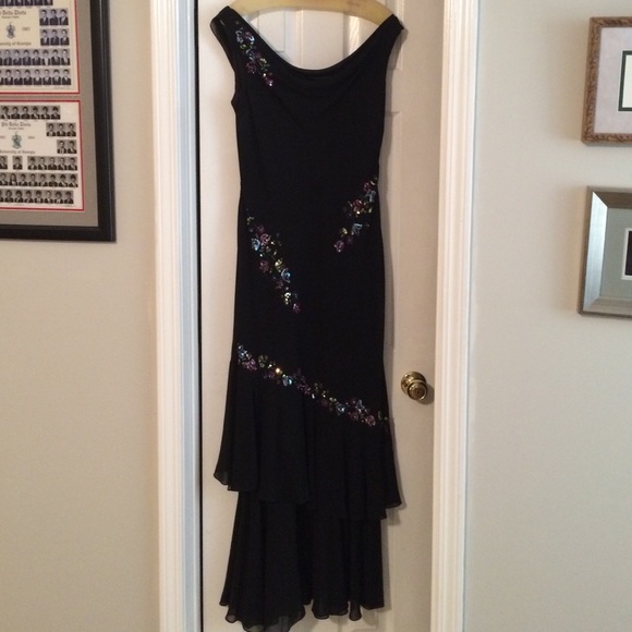 Scoop neck black gown with ruffled hem