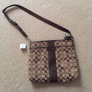 Brown Coach purse with tags