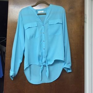 Light blue and light weight CK blouse.
