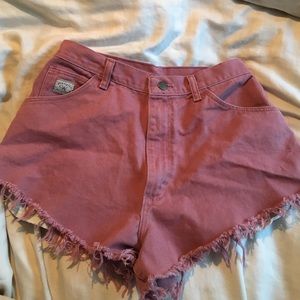 Pink wrangler cut off shorts