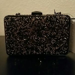 Gold and black sparkly clutch with chain