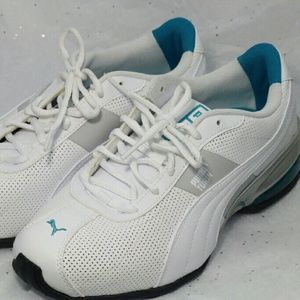 White Puma shoes with Teal accents