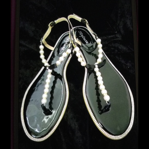 Black patent sandals with pearls and rhinestones.