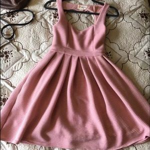 A pink dress with cute backless design.