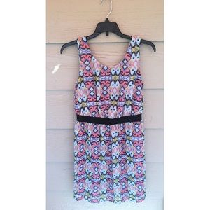Bright, high waisted skater dress with open back.