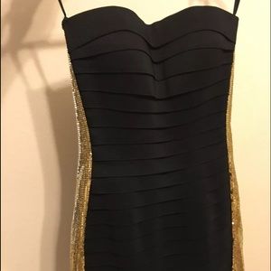 Sherri Hill black dress with gold sides.