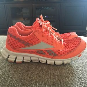 Bright coral/orange Reebok RealFlex CushRun