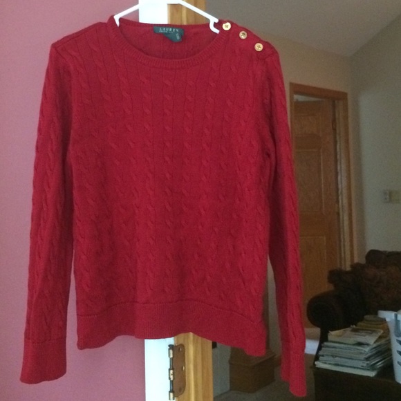 Red sweater/gold colored buttons on left shoulder